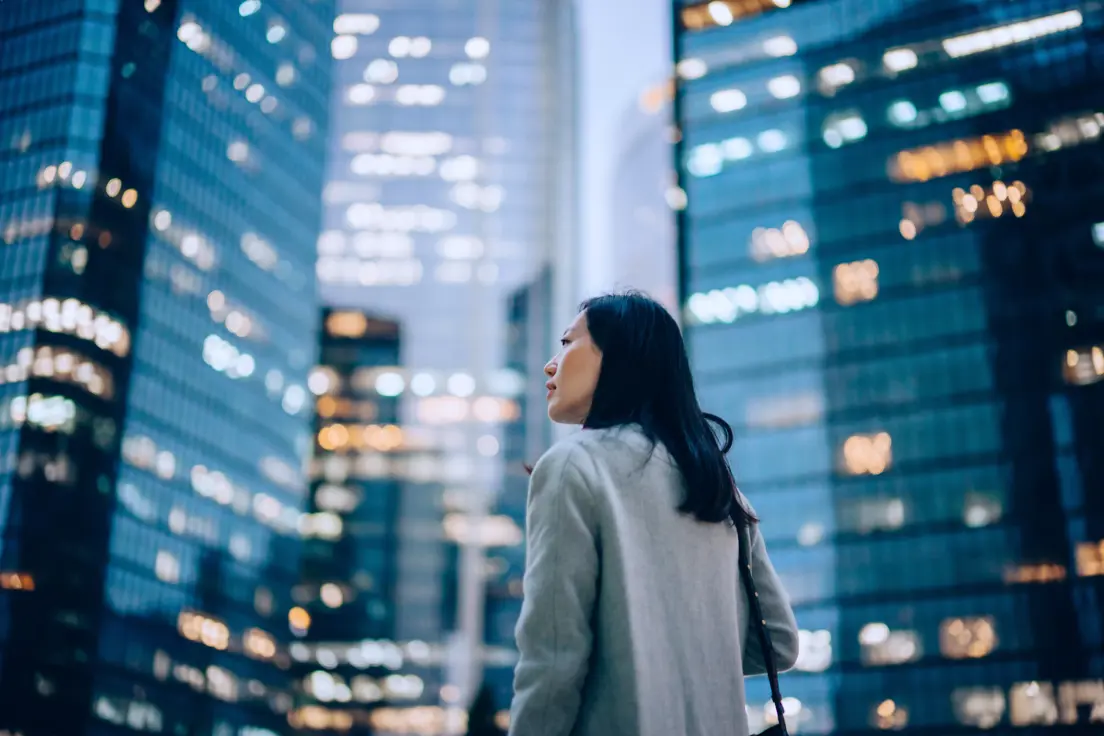 someone standing next to buildings